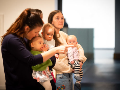 Photo of mothers holding babies in gallery